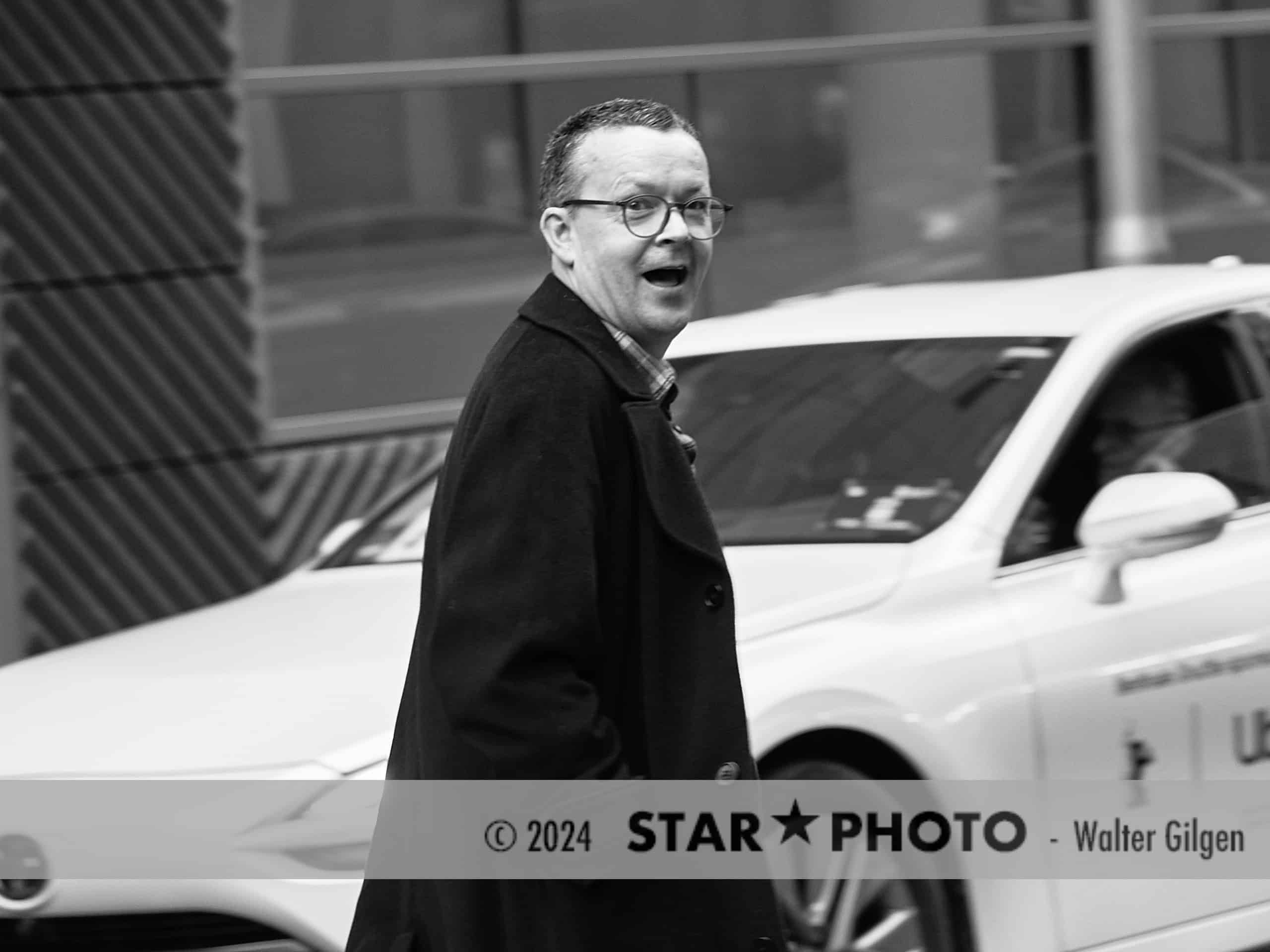 Irish novelist and screenwriter Enda Walsh leaving press conference.