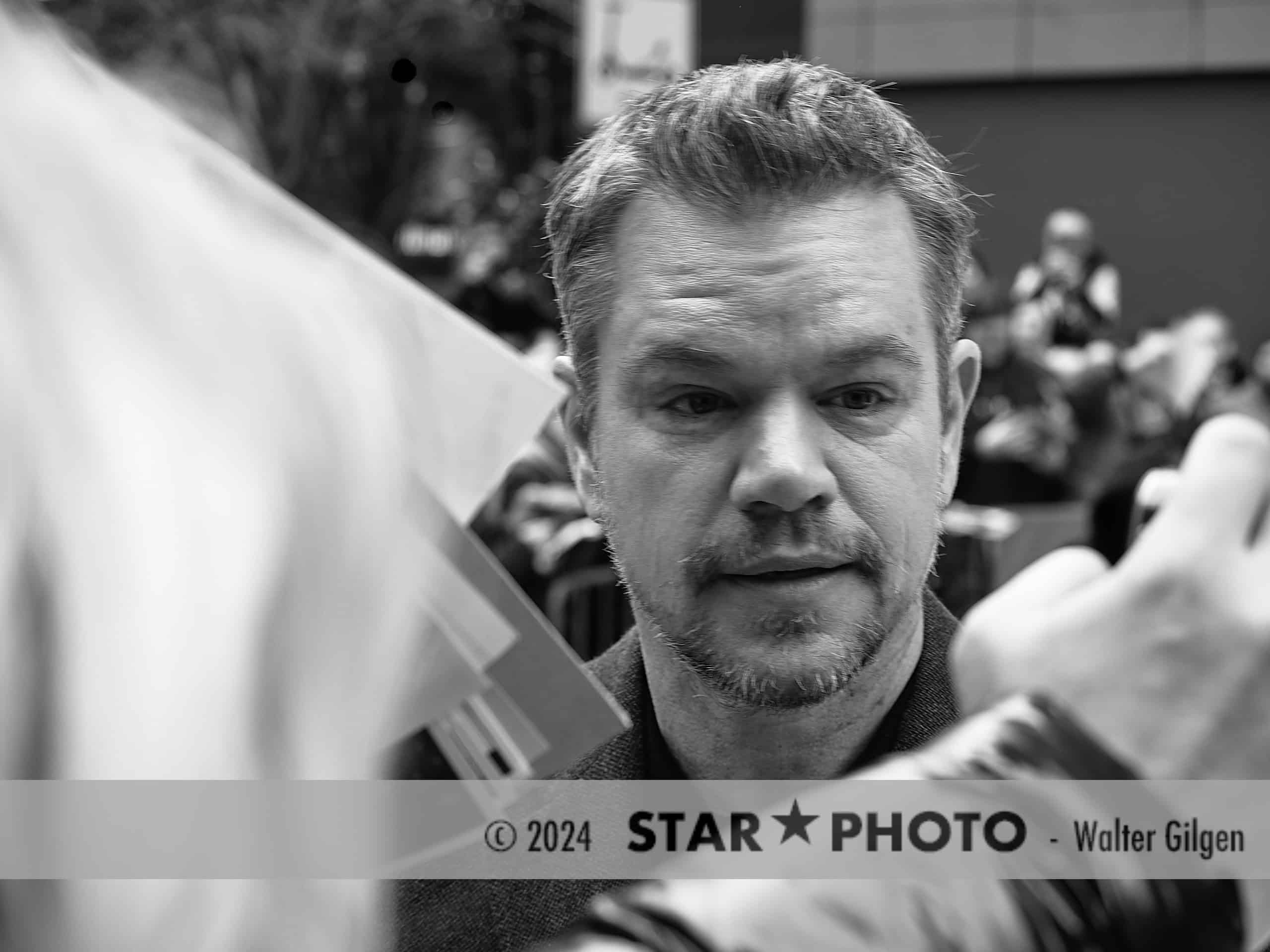 Actor and producer Matt Damon after press conference with fans. He signs autographs and has fun.