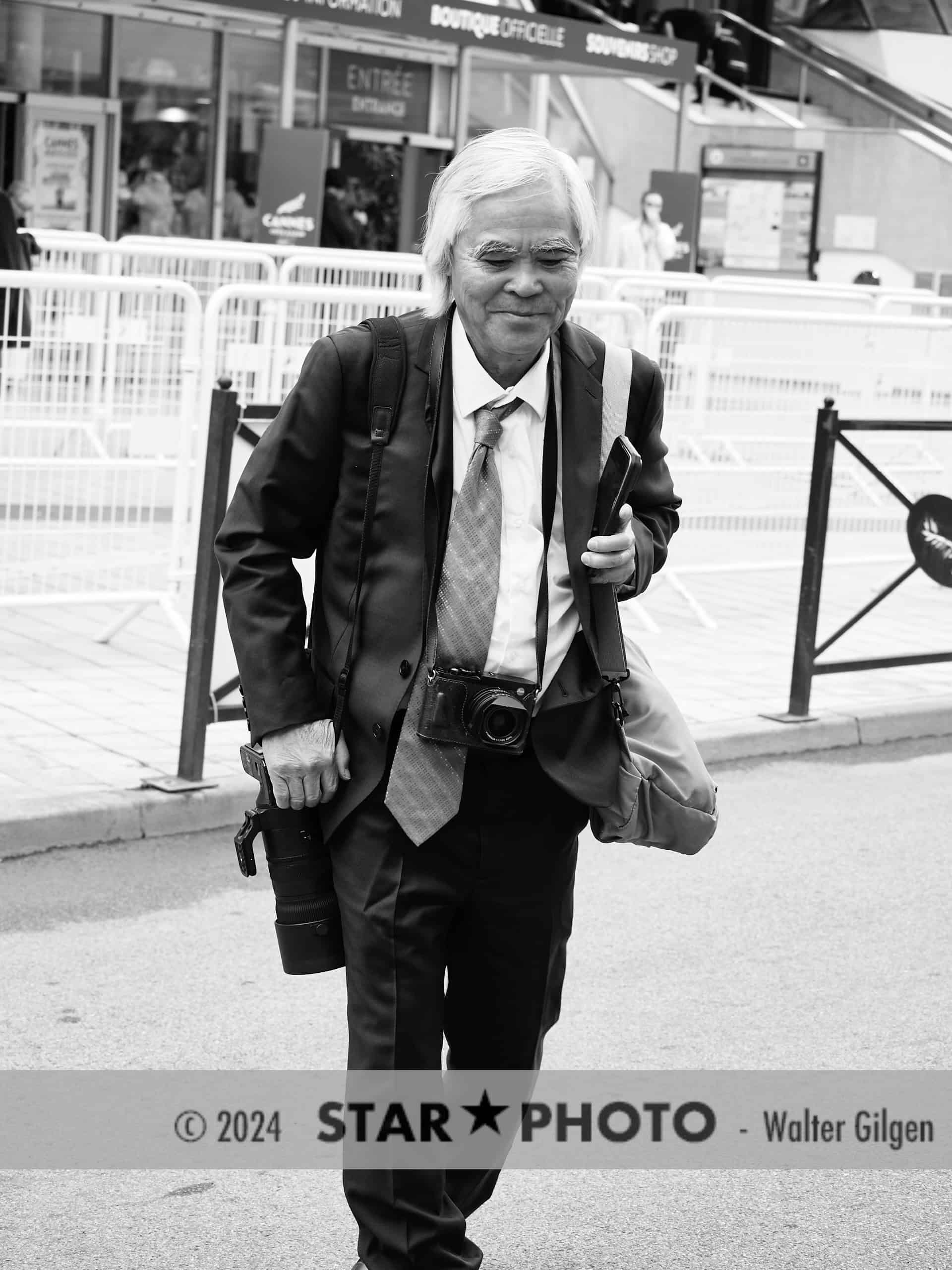 Cannes, France, 14th May, 2024.

Photographer Nick Út seen in Cannes in front of festival center. 

Credits: Walter Gilgen